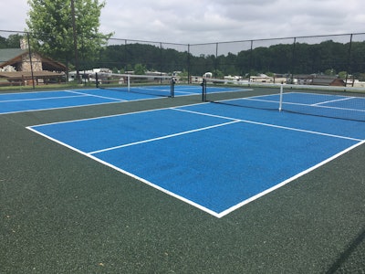 Experienced pickleball players appreciate that the new rubber makes the surface non-slip and more impact absorbing and less jarring and easier on their joints than acrylic-coated asphalt.