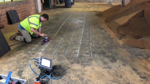 GPR technician using the StructureScan Mini XT to mark concrete reinforcement and utilities in a bourbon distillery.