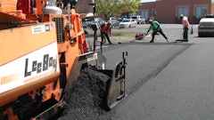 If the proper amount of mix is placed in the proper place, no raking of the mix at the longitudinal joint is necessary.