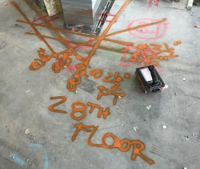 Shown is a GPR scan of a commercial space. Orange marks indicate the location of post-tension cables and reinforcement.