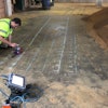 GPR technician using the StructureScan Mini XT to mark concrete reinforcement and utilities in a bourbon distillery.