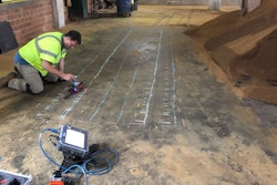 GPR technician using the StructureScan Mini XT to mark concrete reinforcement and utilities in a bourbon distillery.