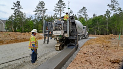 The Wirtgen SP 15i with AutoPilot 2.0 was also used to pave the curb/gutter profile in a new residential development in Moseley, VA.