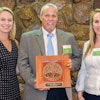 Jim Whitfield, MAPEI Corporation’s Director of Technical Services, and Brittany Storm, MAPEI Corporation’s Sustainabaility Manager, receiving the award.