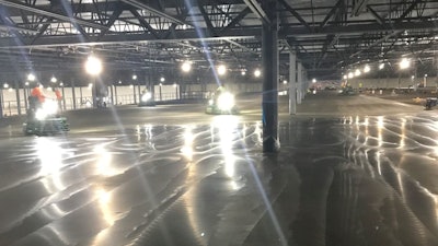 Warehouse slab on metal deck finishing process.