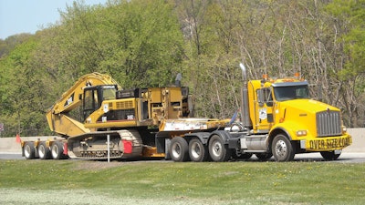 The components calculated in a trailer’s capacity rating include size and weight of the load, the overall weight the trailer can carry, the area of deck that weight can safely be carried in, optimal travel speed and the safety factor.