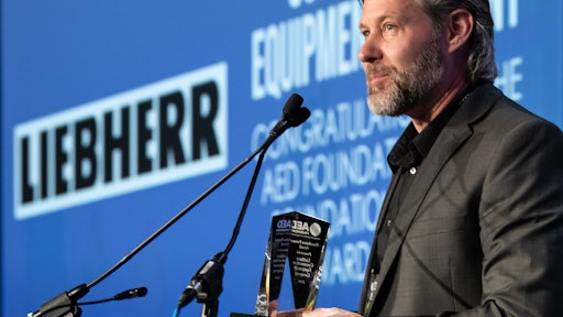 Peter Mayr, managing director of Liebherr USA, Co. accepts the AED Foundation Partner Award in Chicago on January 14, 2020.