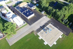 Asphalt Contractors Inc.'s donation to Kansasville Grade School, Kansasville, WI, included placing a 4-in. asphalt surface in two lifts, and excavating and placing the stone base for an additional 60-ft. x 207-ft. parking lot.