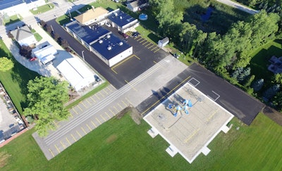 Asphalt Contractors Inc.'s donation to Kansasville Grade School, Kansasville, WI, included placing a 4-in. asphalt surface in two lifts, and excavating and placing the stone base for an additional 60-ft. x 207-ft. parking lot.