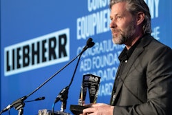 Peter Mayr, managing director of Liebherr USA, Co. accepts the AED Foundation Partner Award in Chicago on January 14, 2020.