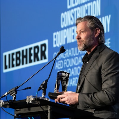 Peter Mayr, managing director of Liebherr USA, Co. accepts the AED Foundation Partner Award in Chicago on January 14, 2020.