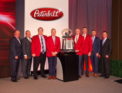 Peterbilt recognizes TLG Peterbilt as 2019 Peterbilt Dealer of the Year. From left to right Peyton Harrell (Peterbilt), Robert Woodall (Peterbilt), Kory Larson (TLG), Glenn Larson (TLG), Kyle Larson (TLG), Mike Headley (TLG), Jason Skoog (Peterbilt) and Leon Handt (Peterbilt).