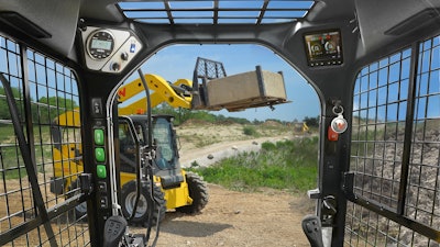 The operator's cab-view from the SW32 skid steer.