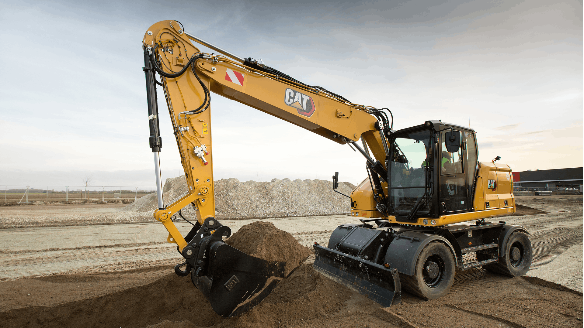 Caterpillar M314 and M318 Wheel Excavators From: Caterpillar