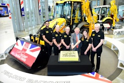 Pictured left to right: JCB backhoe loader employees Nihal Dhillon, Phil Starbuck, John Plant, JCB Chairman Lord Bamford, Shannon Ramczykowski and Keith Bloor celebrating the production of the 750,000th JCB backhoe loader at JCB World HQ, Rocester, Staffordshire.