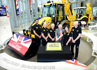 Pictured left to right: JCB backhoe loader employees Nihal Dhillon, Phil Starbuck, John Plant, JCB Chairman Lord Bamford, Shannon Ramczykowski and Keith Bloor celebrating the production of the 750,000th JCB backhoe loader at JCB World HQ, Rocester, Staffordshire.