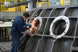 Man Welding Round Window Frame 2965260