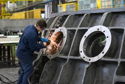 Man Welding Round Window Frame 2965260