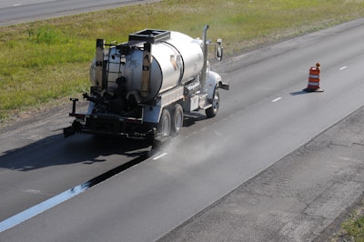 What’s unique about a void-reducing asphalt membrane is that it is applied beneath the asphalt mat before the mat is placed. It is sprayed beneath where the longitudinal joint will be.