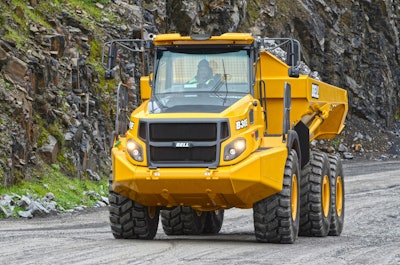 Bell Trucks feature a tipping function, I-Tip, where a push of a button places the transmission in neutral, puts the park brake on and lifts the bed, increasing the rpm to speed up the tip function