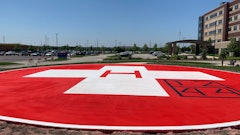 The concrete contractor used a wax-based sealer to slow the curing process of concrete to prevent cracking, but because Pavement Solutions couldn’t wait to apply the paint, they knew they would be repainting the helipad within a year.