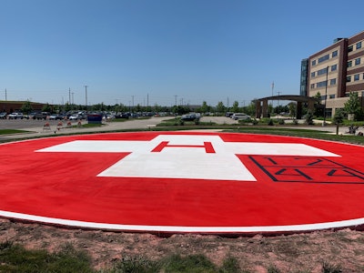 The concrete contractor used a wax-based sealer to slow the curing process of concrete to prevent cracking, but because Pavement Solutions couldn’t wait to apply the paint, they knew they would be repainting the helipad within a year.
