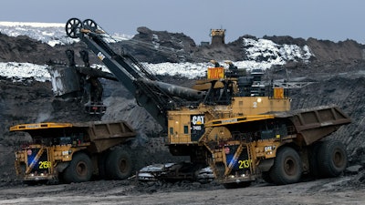 Two Cat 797 F Autonomous Trucks Being Loaded In Pit 5eaad518390a0