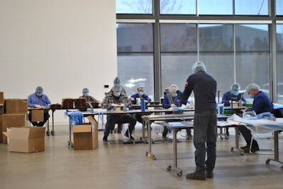 Genie team members making face coverings