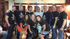 The Stasi Brothers team celebrates a Joe Stasi (in white) milestone.