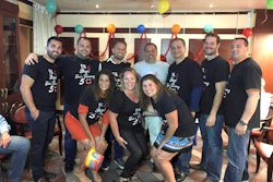 The Stasi Brothers team celebrates a Joe Stasi (in white) milestone.