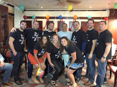 The Stasi Brothers team celebrates a Joe Stasi (in white) milestone.