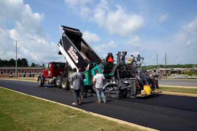 ST Bunn Construction uses Super 1703-3i wheeled paver on parking lot.