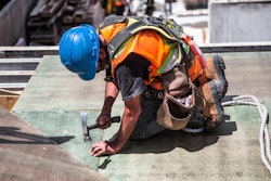 Man Wearing Blue Hard Hat Using Hammer 544966