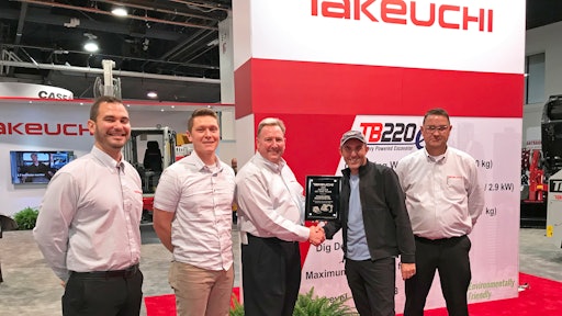 Executives from Feenaughty Machinery Company receiving the Takeuchi Dealer of the Year Award