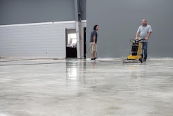 Pastor Josh Moore assists Roy Mathis of GranQuartz polishing the Ameripolish Smartfloor process.