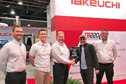 Executives from Feenaughty Machinery Company receiving the Takeuchi Dealer of the Year Award