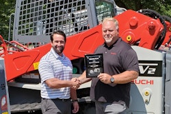 Mr. Bill Smith receiving the Top Salesman of the Year Award for the third time.