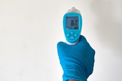 Person Wearing A Rubber Glove 4021186