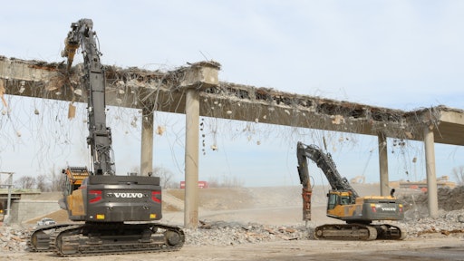 Greg Bair Track Hoe Services Inc. used a Volvo EC750E HR and a EC480D high-reach demolition excavator working side by side to demolish the two bridges in a very tight time frame.