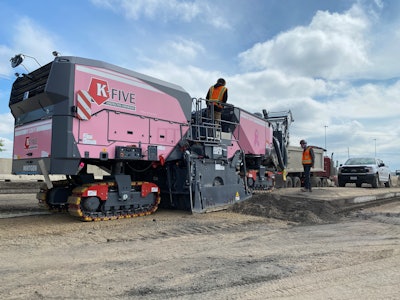 The new F-Series Wirtgen mills include the option to add a customizable wrap around the machine. While most companies utilize this to add a logo or company colors, K-Five Construction’s shop manager, Dave Gorski, came to them with the idea for a pink wrap as a way to promote cancer awareness.