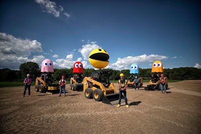 During the video, the five players race their machines around the exact 3D replica of the iconic PAC-MAN™ board to simulate gameplay of the original arcade game. The movement is all done through remote control operation far above the constructed maze, utilizing 236D3 Skid Steer loaders from The Cat Rental Store.