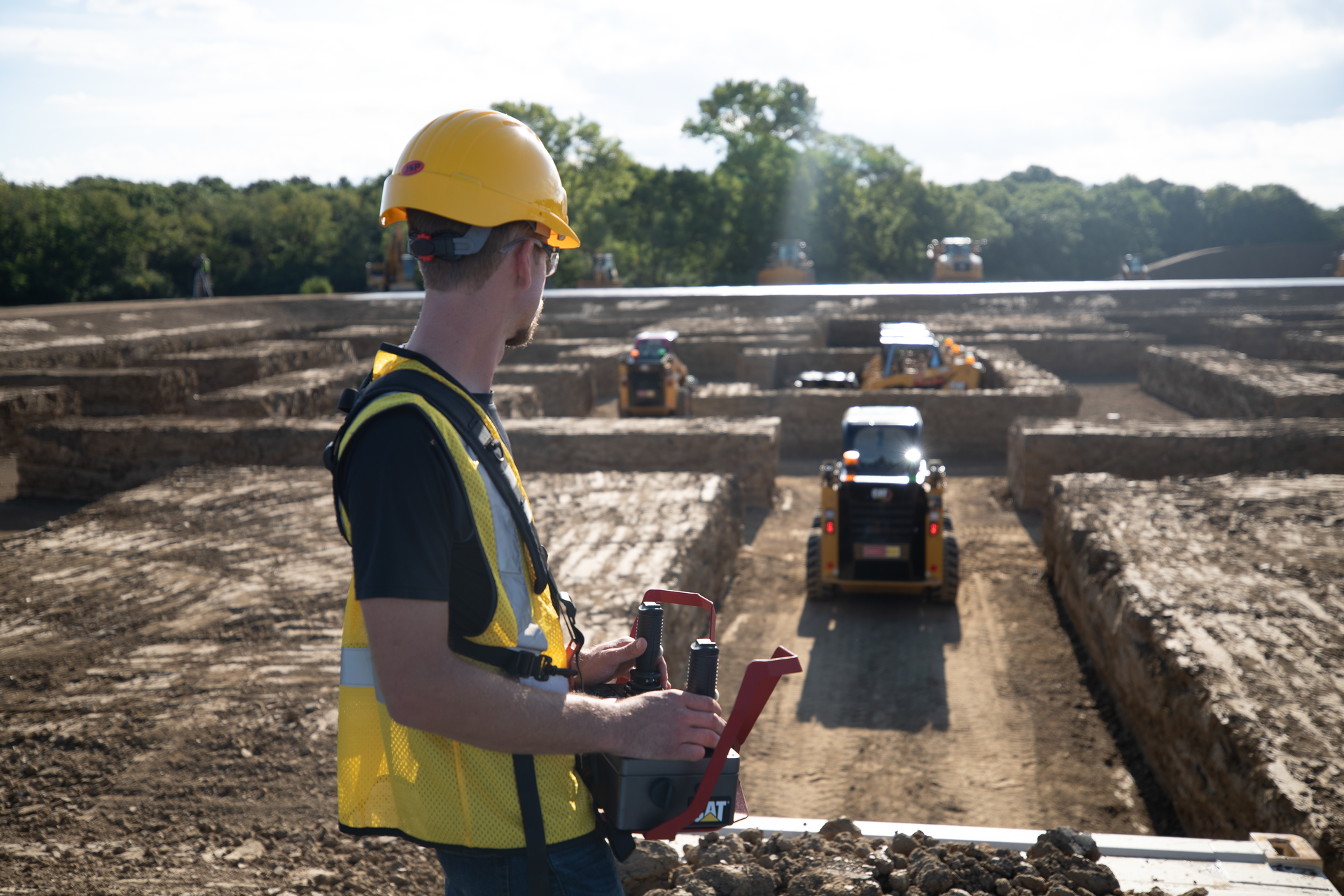 During the video, five players race their machines around an exact 3D replica of the iconic PAC-MAN&trade; board to simulate gameplay of the original arcade game. The movement is all done through remote control operation far above the constructed maze, utilizing 236D3 skid steer loaders from The Cat Rental Store.