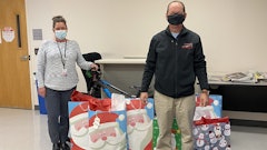 Erick Finley, owner of Finley Asphalt & Concrete donates presents to Prince William County Department of Social Services. These gifts benefit children who are in their foster care program.