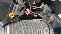 Install eye hooks on each side of the sweeper head and the broom.