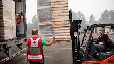 American Red Cross volunteers use donated Toyota Material Handling equipment to move relief supplies during the recent Oregon wildfires. Toyota has pledged material handling equipment to the Red Cross to respond to any North American natural disaster as a part of a unique partnership with American Red Cross.
