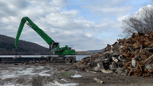 A Sennebogen 840 M was used on a power plant project in Ohio, where barge loading operations required a heavier machine with longer reach.