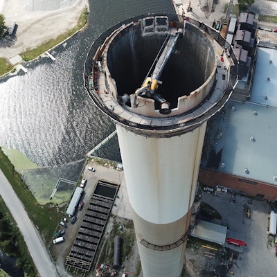 A Mantis system broke the concrete smokestack down to a safe level for wrecking balling.