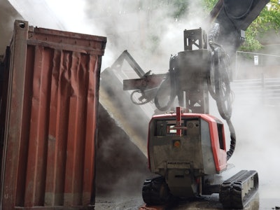 Contractors repurposed an old shipping container for shields to contain blast water and increase safety on the bustling jobsite.