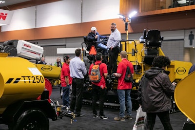 Attendees can see, touch and climb on machines during the expo portion of NPE