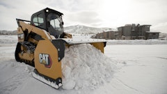 The first and most common method loaders are usually equipped for snow removal is is to push or scrape to clear the snow. This is done using a plow blade, a larger snow pusher and occasionally still a bucket. Snow pushers are wider and taller than a bucket, so they are capable of clearing more area quickly as shown by this Caterpillar 289D Compact Track Loader with a snow pusher.
